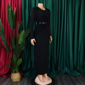 Detail view of black slim-fit dress featuring mesh sleeves and matching waist belt