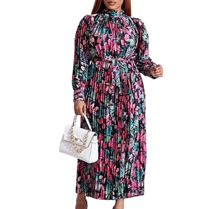 Detailed view of floral pleated maxi dress with elegant high neck and waist tie belt
