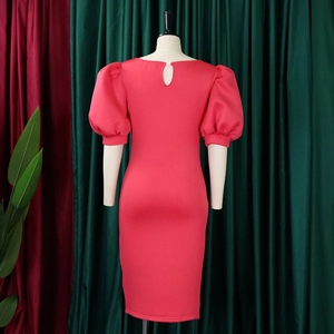 Detail view of the rose red dress back showing puff sleeves and teardrop cutout