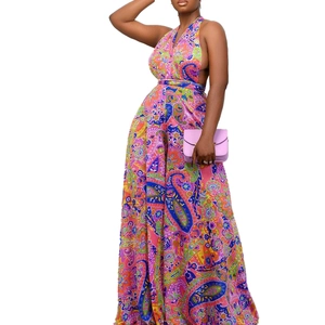 Detail of paisley print halter neck jumpsuit with deep V-neck and crisscross waist ties