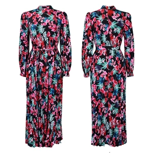 Detail of plus size long sleeve floral maxi dress with high neck and pleated skirt