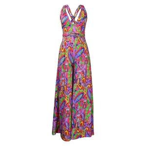Detail of colorful paisley print jumpsuit with cross back straps and vibrant patterns