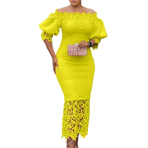 Detail of floral lace hem and off-shoulder neckline on bright yellow dress