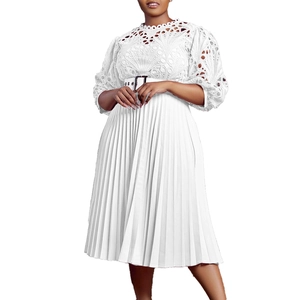 Detail of white lace hollow-out dress with pleated hem and silver buckle belt