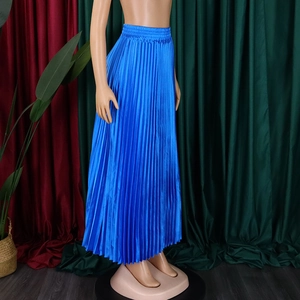 Detailed view of bright blue pleated maxi skirt with elastic waistband and satin finish