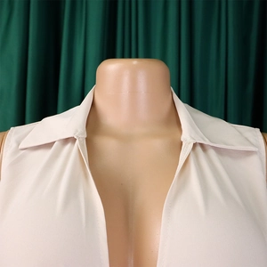 Close-up of elegant deep V-neck and shirt collar detail on light pink sleeveless jumpsuit