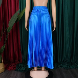 Detail of high waist elastic band on royal blue pleated maxi skirt with satin finish