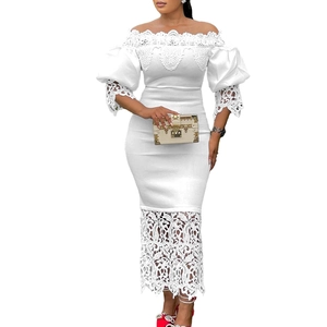 Detail view of exquisite lace patchwork and puff sleeves on white off-shoulder evening dress