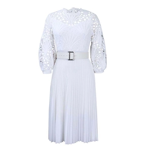Detail of white lace bodice and pleated skirt featuring a metallic D-logo buckle belt