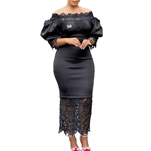 Detail of the silver bow brooch on black off-the-shoulder lace dress for women
