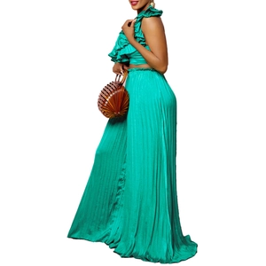 Detail of teal ruffled crop top and pleated wide-leg trousers with metallic sheen