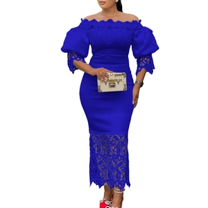 Detail of the elegant lace embroidery on the off-shoulder neckline of this blue dress