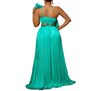 Detail view of one-shoulder top with back zipper and matching pleated wide-leg pants