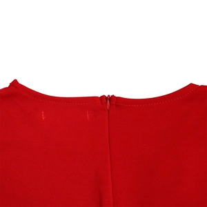 Detail of round neckline and invisible back zipper on the solid red dress fabric