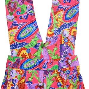 Detail of vibrant floral print jumpsuit with plunging V-neck and matching waist belt