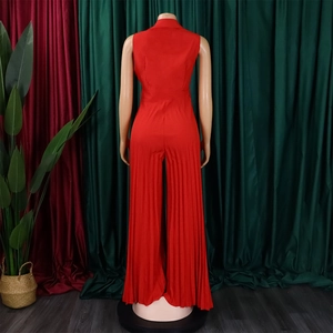 Rear view detail of a vibrant red sleeveless jumpsuit featuring wide-leg pleated pants