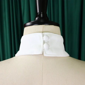 Close-up of white detachable stand collar with two buttons on the back on mannequin
