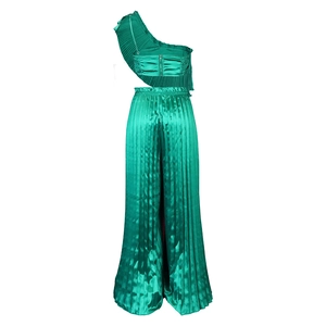 Detail view of the emerald green satin crop top with ruffles and pleated wide leg pants