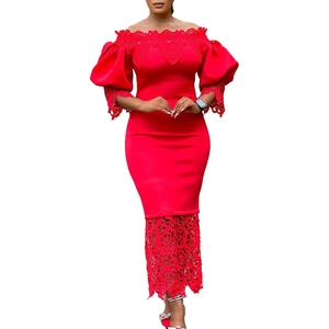 Detail of red off-shoulder gown featuring lace splicing and elegant puff sleeves