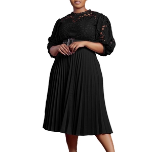 Detail of elegant black lace bodice with pleated skirt and wide buckled leather waist belt