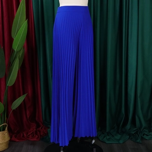 Close-up of royal blue high waist pleated wide-leg trousers with side slit on mannequin