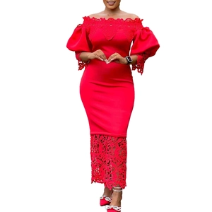 Detail of red off-shoulder gown with puffy sleeves and intricate floral lace embroidery