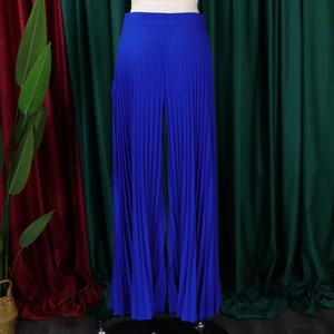Close-up of pleated texture on high-waisted royal blue wide-leg trousers for women
