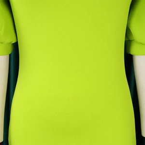 Detail of puff sleeves and bright neon green fabric texture on this slim-fit knit dress