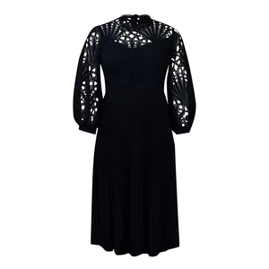 Close-up of black lace hollow-out design and elegant textured embroidery on long sleeves