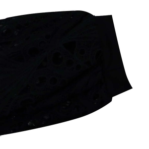 Detailed close-up showing the intricate hollow lace floral pattern on elegant black fabric