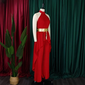 Detail showing red halter neck dress with pleated fabric and gold belt decoration