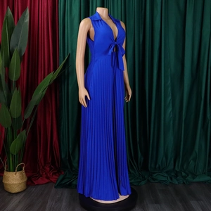 Detail of royal blue pleated wide-leg jumpsuit with V-neckline and tie front design