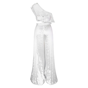 Detailed view of white pleated two-piece set featuring satin finish fabric texture