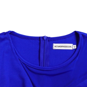 Detailed close-up of royal blue crew neck with a concealed back zipper and brand tag