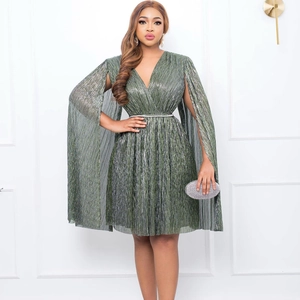 Detail of elegant dark green metallic pleated V-neck dress with long cape sleeves and belt