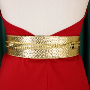 Detail of a wide gold snakeskin textured belt with elegant braided cord accents