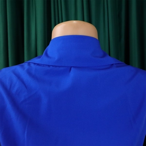 Detailed view of the royal blue V-neck jumpsuit with a classic collar and pleated fabric texture
