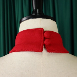 Detailed macro shot of a red mandarin collar featuring exquisite handmade knot buttons