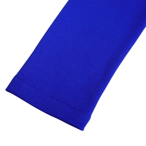 Detail of royal blue mesh stitching on long sleeves with refined knit texture