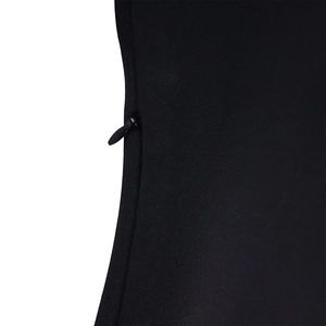 Detailed view of invisible side zipper on a sleek black puff sleeve dress fabric
