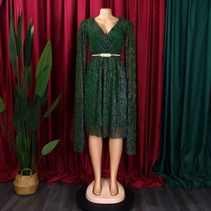 Deep V-neck green pleated dress with elegant cape sleeves and gold waist belt detail