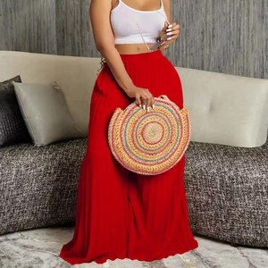 Women's high waist pleated wide leg pants in bright red with flowy draped silhouette