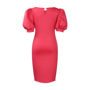 Detail of rose pink puff sleeve dress showing back button closure and waist design