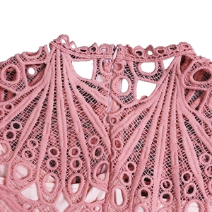Detail of pink lace dress with hollow patterns and invisible back zipper