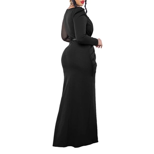 Close-up of the elegant side pleats and ruched mesh detail on the long black dress