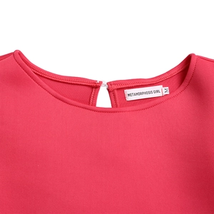 Detail of round neckline with button closure on rose red puff sleeve dress
