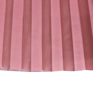 Macro detail of pleated pink chiffon fabric showing fine texture and uniform craftsmanship