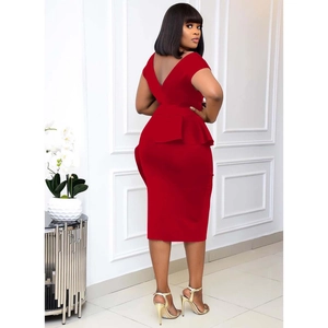 Detail of red V-neck evening dress featuring peplum waist and elegant open back design