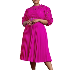 Close-up of fuchsia lace bodice and pleated skirt detail with silver buckle belt