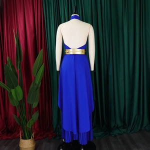 Detail view of Klein blue backless dress featuring a gold belt and pleated hi-lo hemline